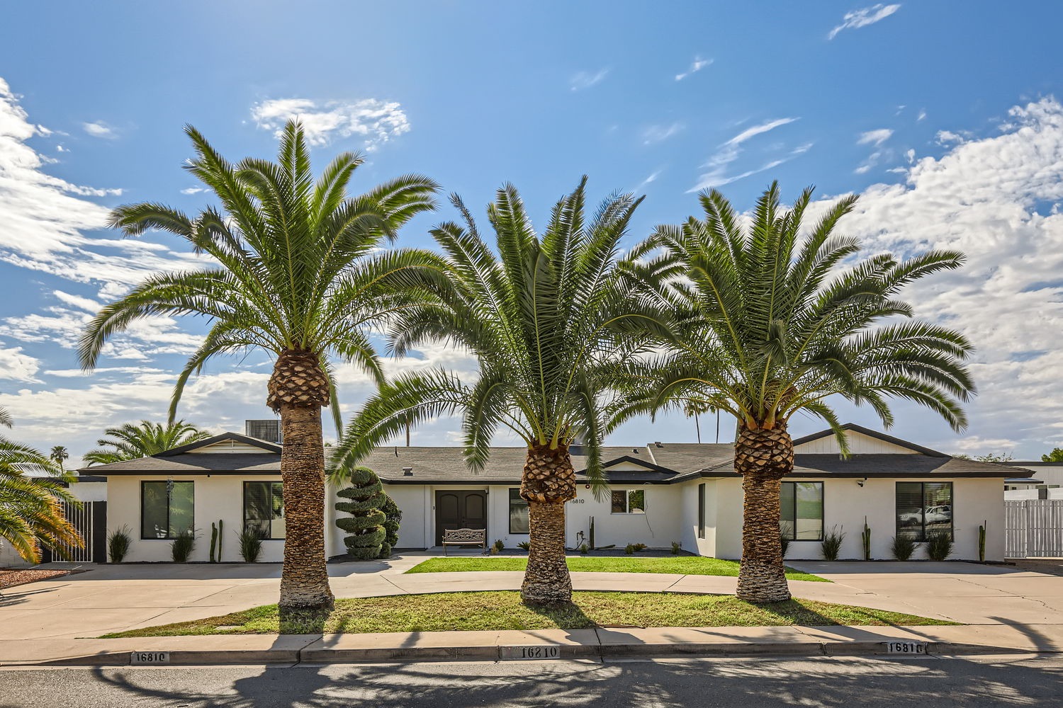 Front entrance of Senior Valley Assisted Living in Phoenix/Scottsdale, featuring a landscaped lawn and welcoming entryway.